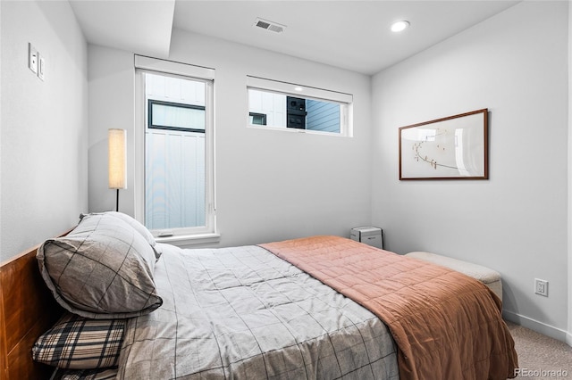 bedroom featuring carpet floors, recessed lighting, visible vents, and baseboards