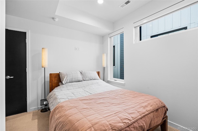 carpeted bedroom featuring recessed lighting and visible vents