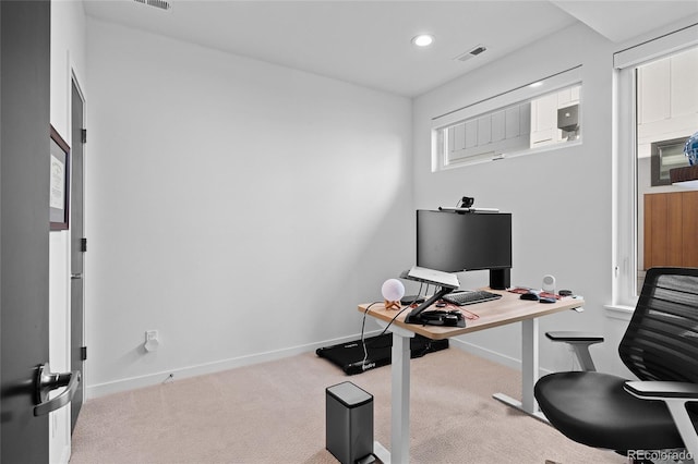 office space featuring carpet floors, recessed lighting, visible vents, and baseboards