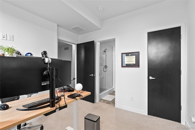 carpeted office with visible vents and baseboards