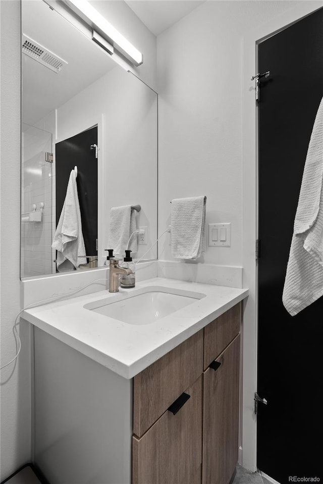 bathroom with vanity and visible vents