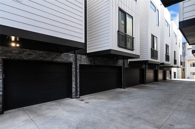 view of side of home featuring an attached garage