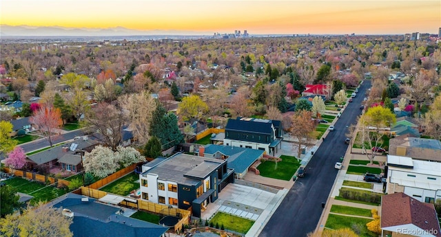 aerial view at dusk featuring a residential view