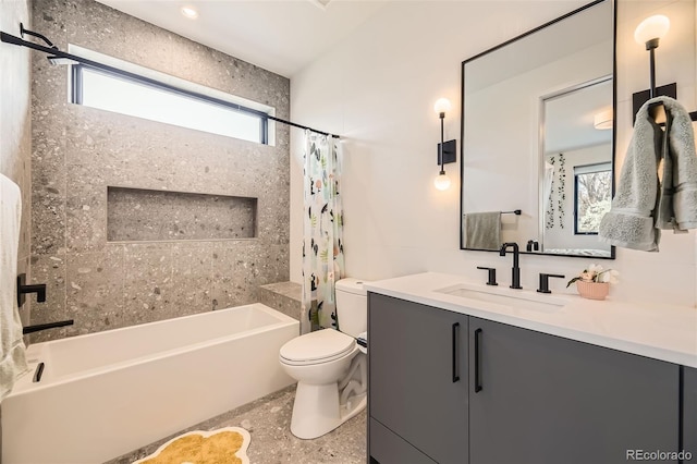 bathroom featuring toilet, vanity, and shower / bath combo with shower curtain