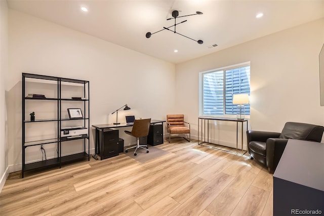 office area with light wood finished floors, baseboards, visible vents, and recessed lighting