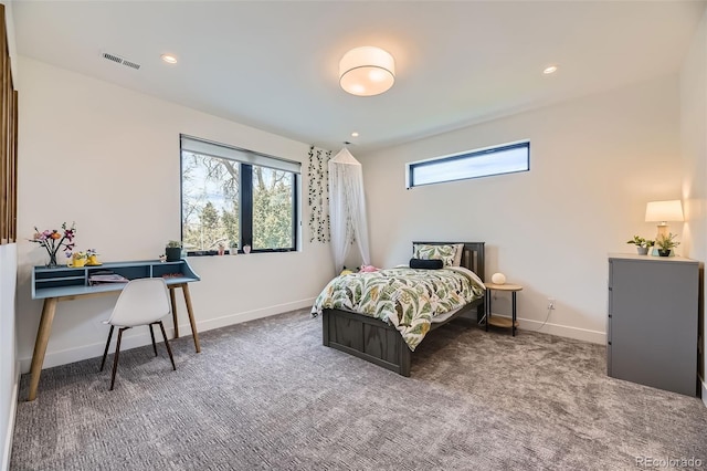 carpeted bedroom featuring baseboards, visible vents, and recessed lighting