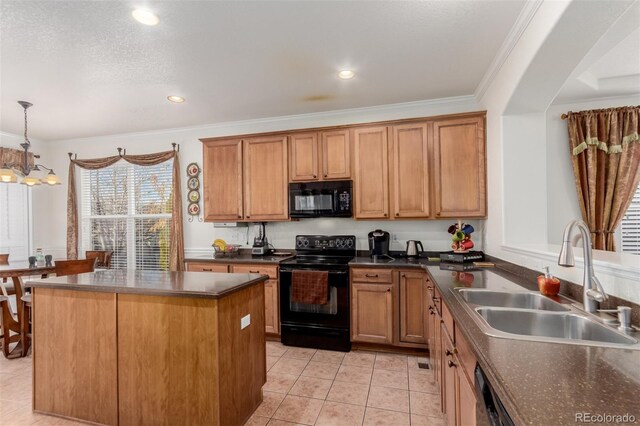 12955 Vallejo Cir, Westminster, CO 80234 - kitchen with black appliances, dark countertops, light tile patterned floors, pendant lighting, and ornamental molding