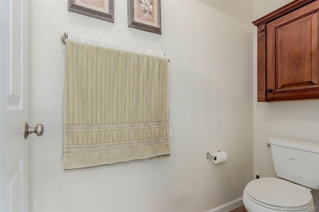 12955 Vallejo Cir, Westminster, CO 80234 - bathroom featuring toilet and baseboards