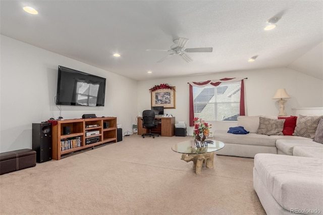 carpeted living room with vaulted ceiling and ceiling fan