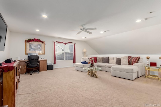 carpeted living room with ceiling fan and lofted ceiling