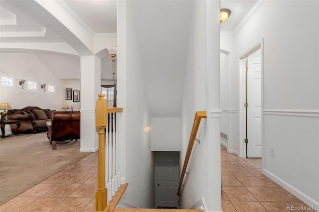 12955 Vallejo Cir, Westminster, CO 80234 - corridor with an upstairs landing, light tile patterned floors, light colored carpet, and ornamental molding