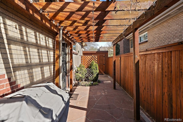 view of patio / terrace with fence and a pergola