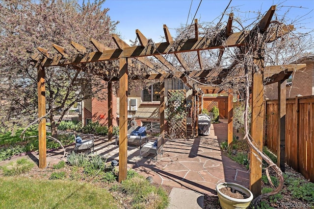view of patio with fence and a pergola