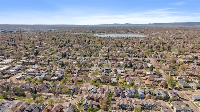 birds eye view of property featuring a residential view and a water and mountain view