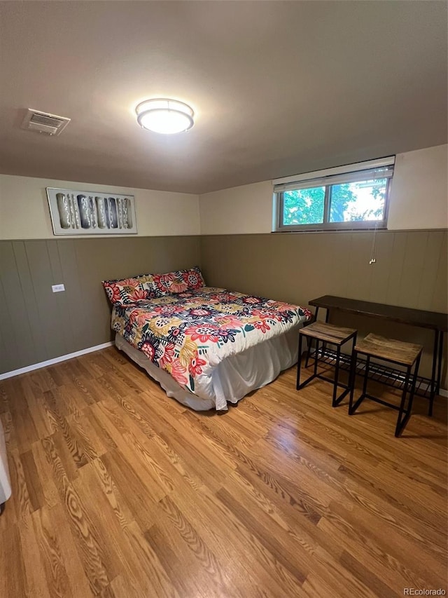 3540 Vrain St, Denver, CO 80212 - bedroom with wood finished floors, wood walls, and a baseboard heating unit
