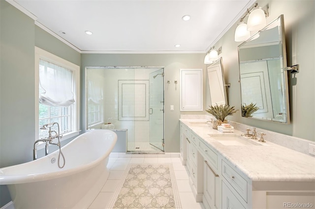 bathroom with crown molding, tile patterned floors, vanity, and separate shower and tub