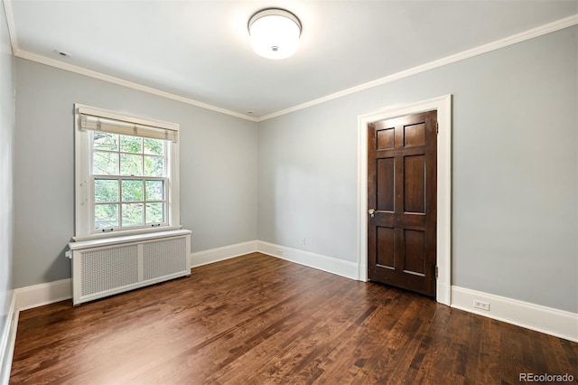 unfurnished room with dark wood-type flooring, radiator heating unit, and ornamental molding