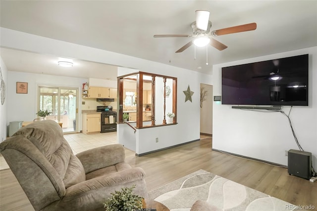 6371 Brooks Dr, Arvada, CO 80004 - living room featuring light wood-style flooring and ceiling fan