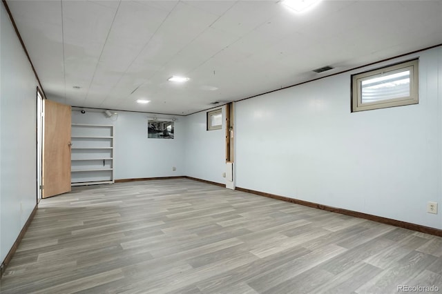 6371 Brooks Dr, Arvada, CO 80004 - basement featuring light wood-style flooring and baseboards