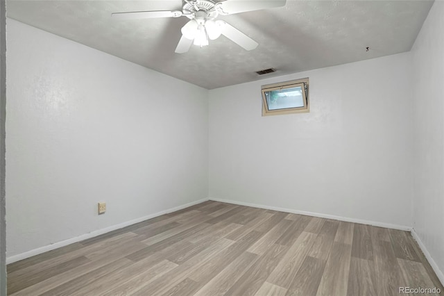 6371 Brooks Dr, Arvada, CO 80004 - spare room featuring wood finished floors and ceiling fan