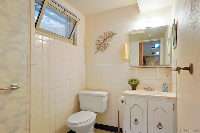 6371 Brooks Dr, Arvada, CO 80004 - bathroom with vanity and tile walls