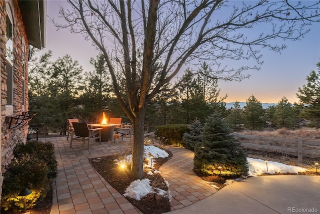 view of patio featuring an outdoor fire pit