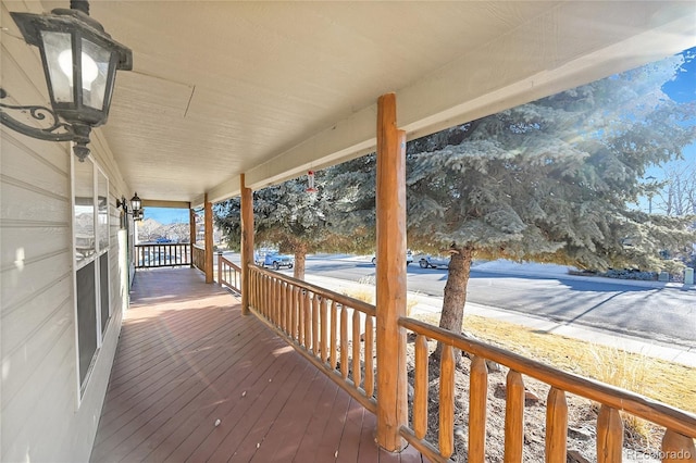 wooden deck featuring covered porch