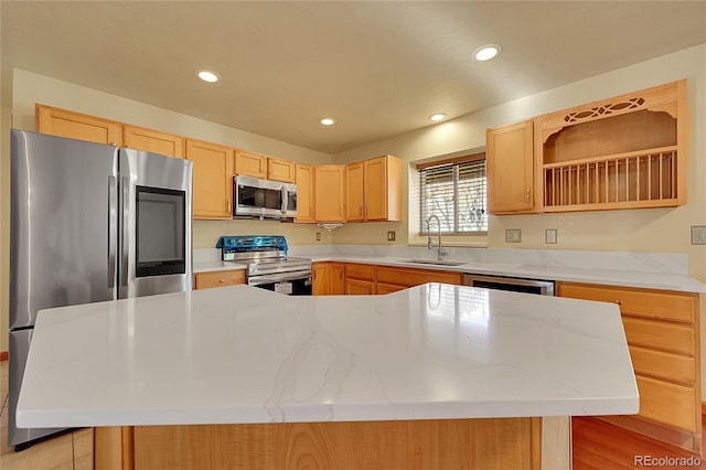 kitchen with stainless steel appliances, open shelves, a sink, a center island, and light brown cabinetry