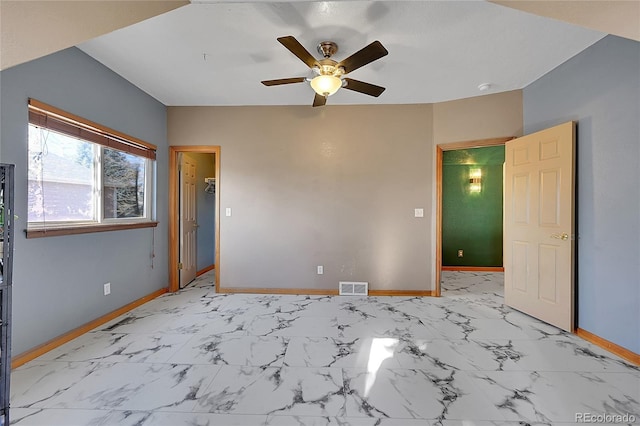 unfurnished bedroom with marble finish floor, visible vents, ceiling fan, and baseboards