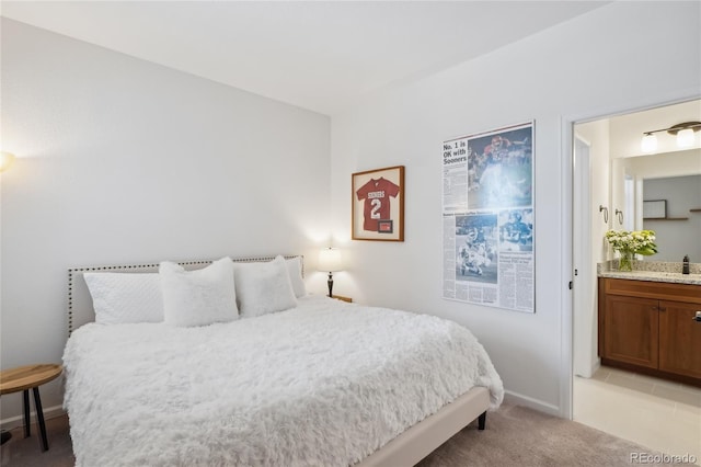 15987 E 115th Pl, Commerce City, CO 80022 - bedroom with light carpet, a sink, baseboards, and connected bathroom