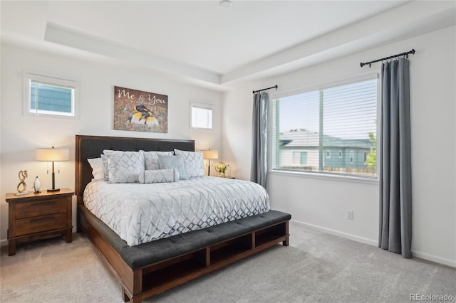 15987 E 115th Pl, Commerce City, CO 80022 - bedroom featuring light colored carpet, a raised ceiling, and baseboards