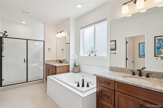 15987 E 115th Pl, Commerce City, CO 80022 - full bath with two vanities, a stall shower, a bath, tile patterned floors, and recessed lighting