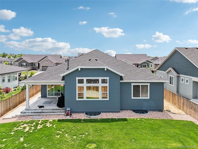 15987 E 115th Pl, Commerce City, CO 80022 - back of house with a patio, roof with shingles, and a residential view
