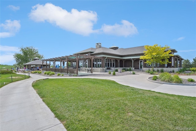 15987 E 115th Pl, Commerce City, CO 80022 - view of community with a lawn and a pergola
