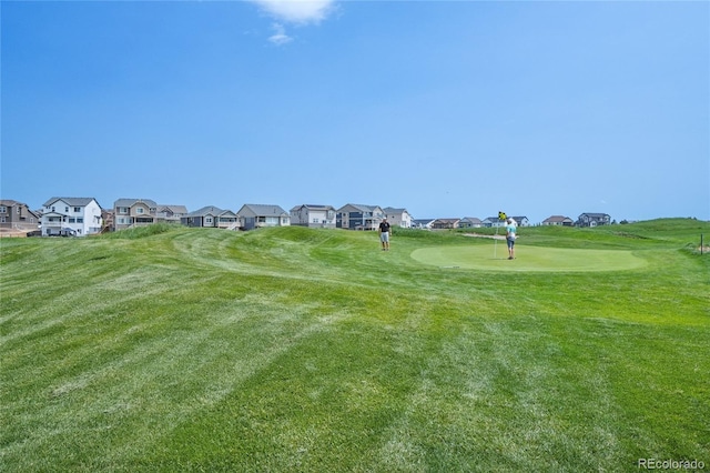 15987 E 115th Pl, Commerce City, CO 80022 - view of community featuring a residential view, a lawn, and golf course view