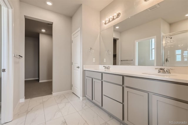 bathroom with vanity and an enclosed shower