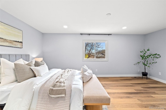 bedroom featuring recessed lighting, baseboards, and light wood-style floors