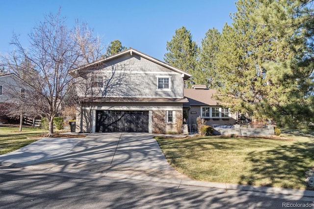 front of property with a front yard and a garage