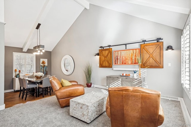 carpeted living room featuring an inviting chandelier, beam ceiling, high vaulted ceiling, and a barn door