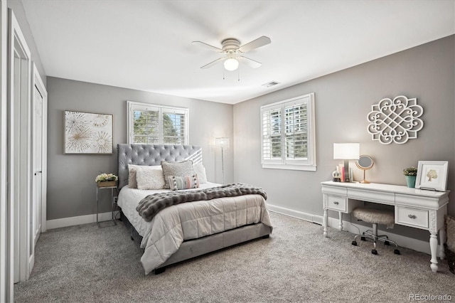 bedroom with ceiling fan, carpet, and multiple windows