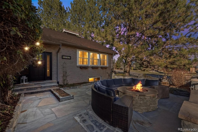 view of patio / terrace with a fire pit