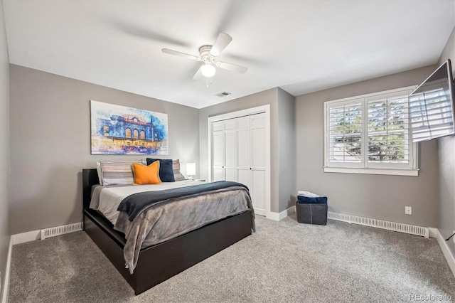 bedroom featuring a closet, carpet, visible vents, and baseboards