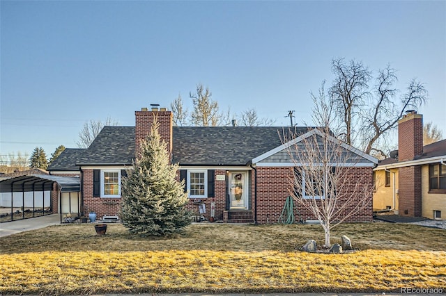 view of front facade with a carport and a front lawn