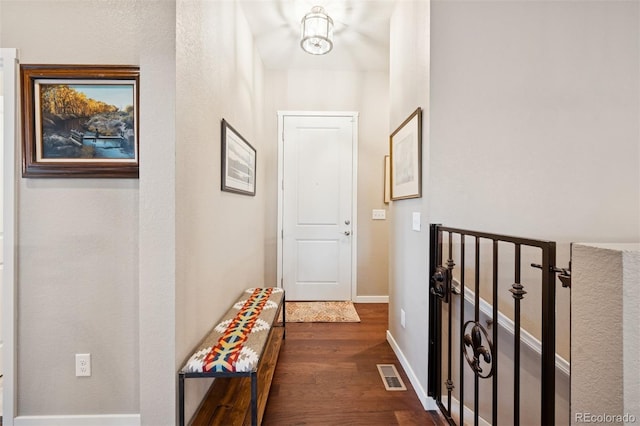 5795 Xenon Way, Arvada, CO 80002 - corridor featuring dark wood-style floors and baseboards