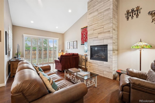 5795 Xenon Way, Arvada, CO 80002 - living area featuring wood finished floors, a fireplace, high vaulted ceiling, and recessed lighting