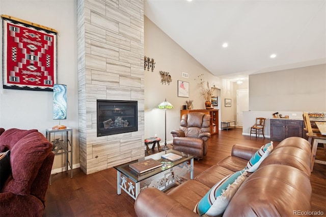 5795 Xenon Way, Arvada, CO 80002 - living area featuring dark wood-type flooring, a fireplace, recessed lighting, and high vaulted ceiling