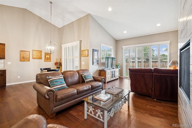 5795 Xenon Way, Arvada, CO 80002 - living room with a chandelier, dark wood finished floors, high vaulted ceiling, and recessed lighting