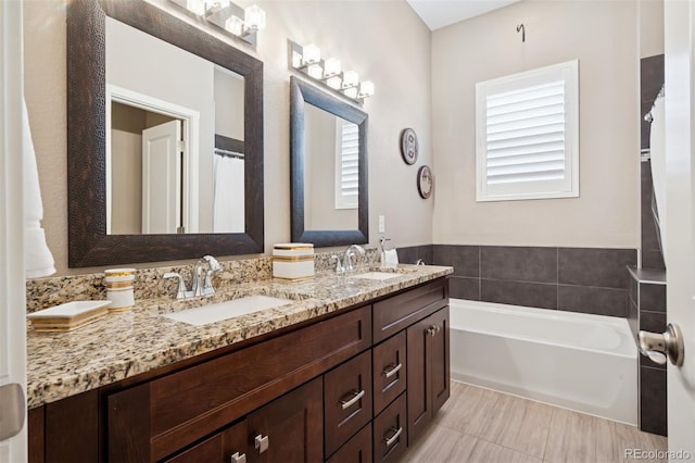 5795 Xenon Way, Arvada, CO 80002 - full bathroom with double vanity and a bath