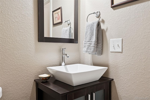 5795 Xenon Way, Arvada, CO 80002 - bathroom featuring a textured wall and vanity