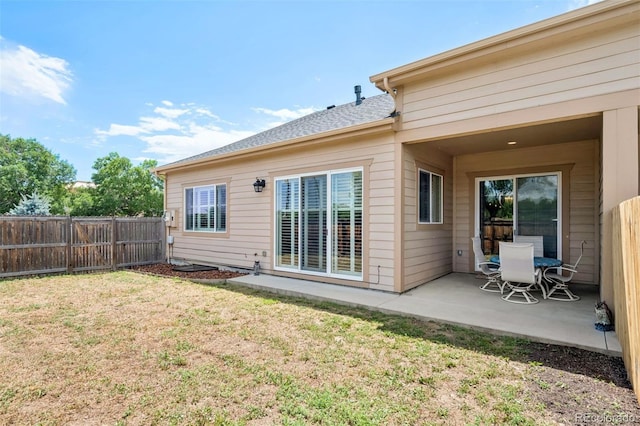 5795 Xenon Way, Arvada, CO 80002 - rear view of property with a patio